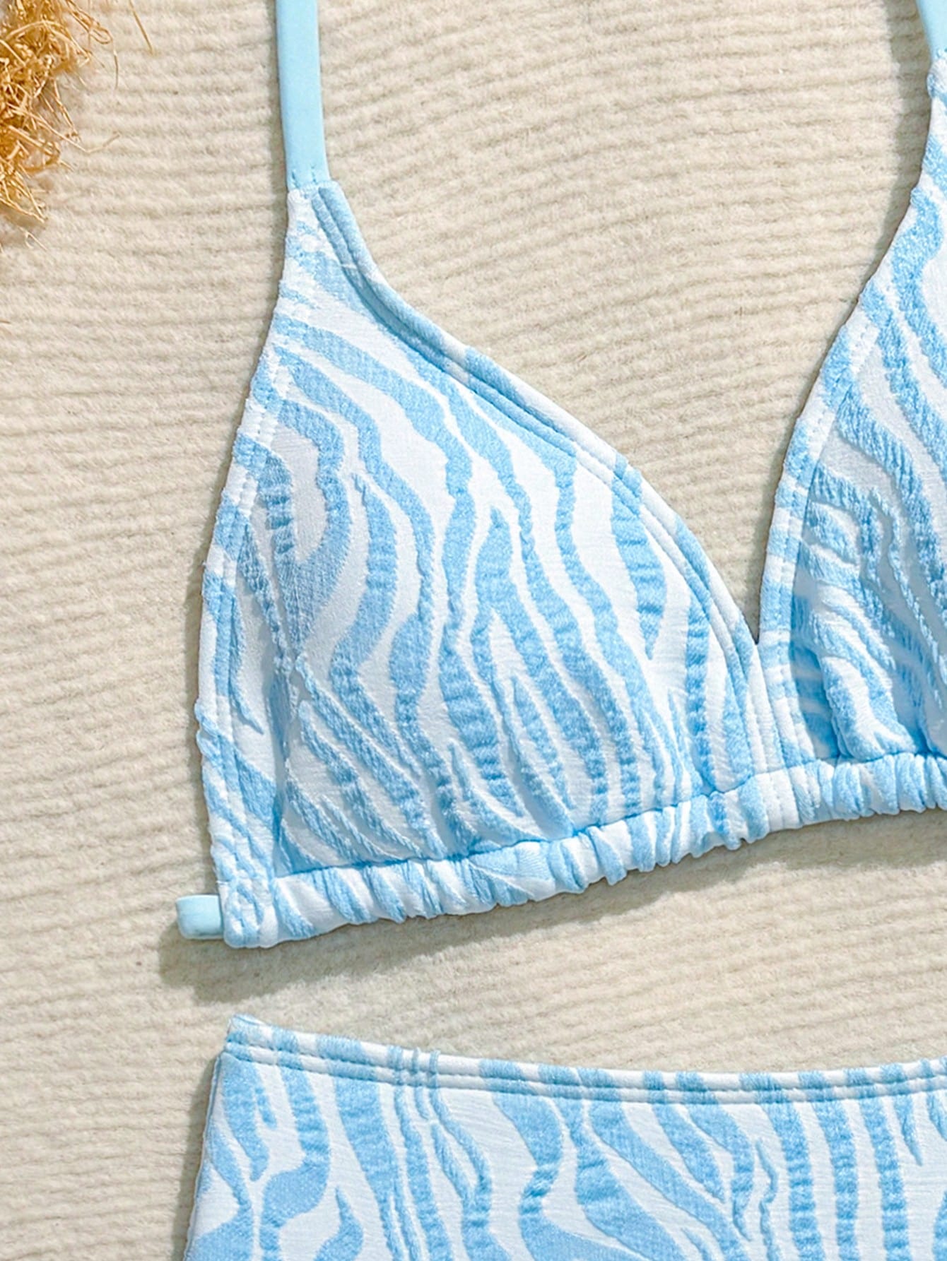 Tween girls blue and white striped two-piece bikini set with halter triangle top and mid-waist short bikini bottoms for beach and vacation swimwear.