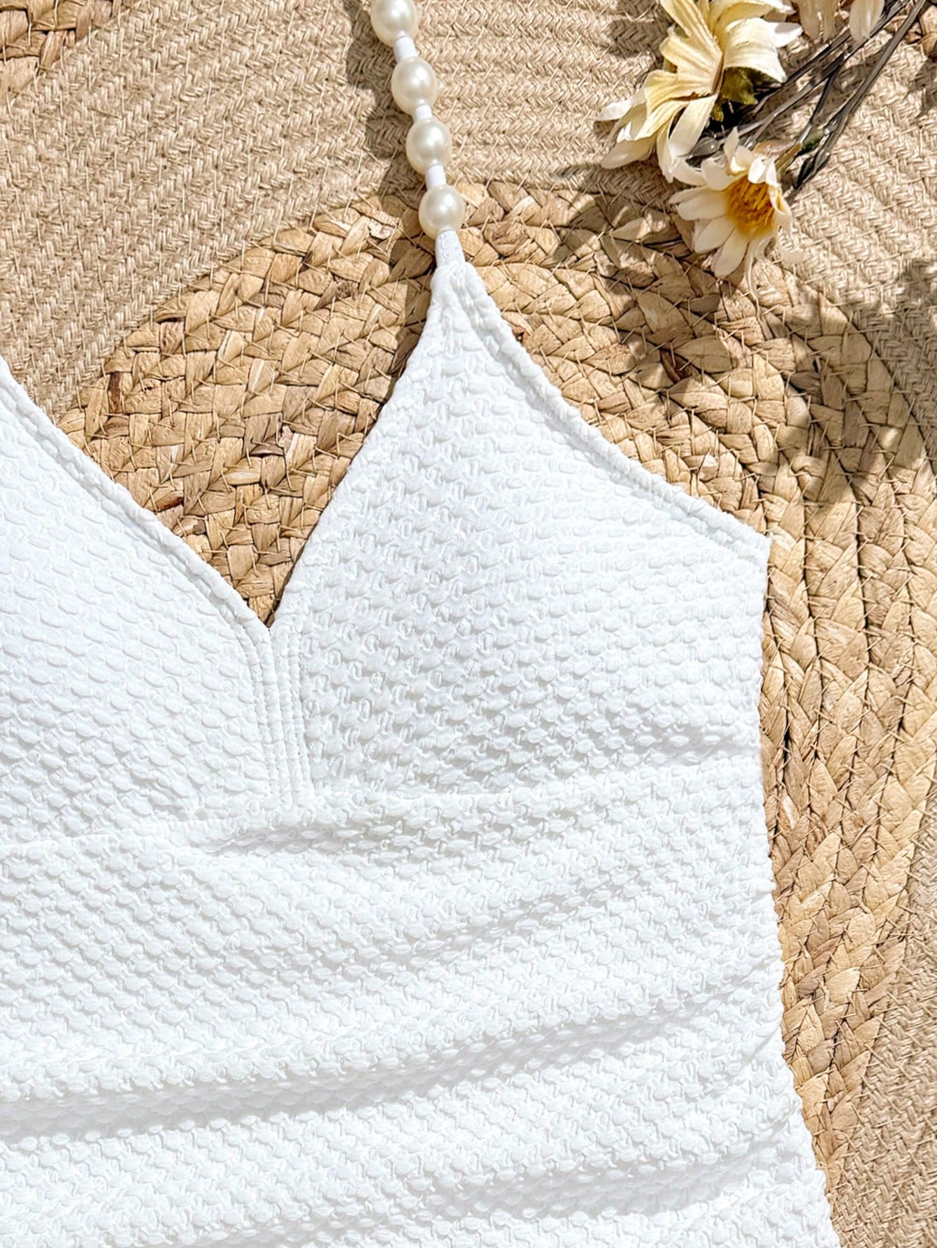 Tween girls 2-piece bikini swimwear set in black with a wave-pattern geometric design, featuring halter neckline, wireless top, and high-waist short bottoms with starfish and shell decor.