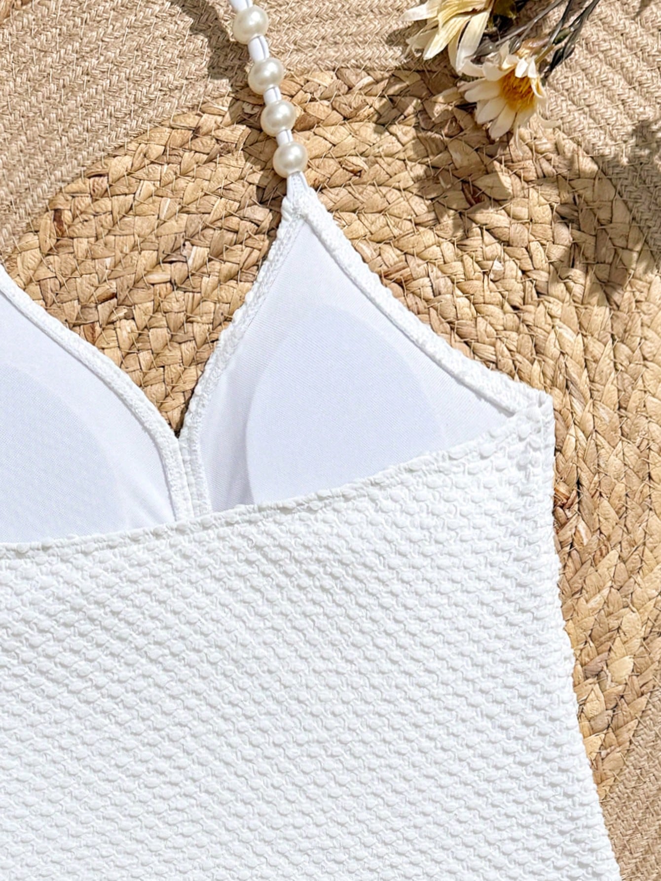 Tween girls 2-piece bikini swimwear set in black with a wave-pattern geometric design, featuring halter neckline, wireless top, and high-waist short bottoms with starfish and shell decor.