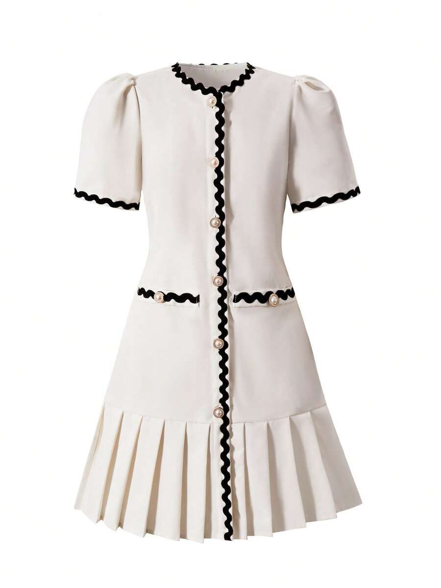 Tween girls apricot short-sleeve pleated smock dress with 3D bow decor and round neckline.