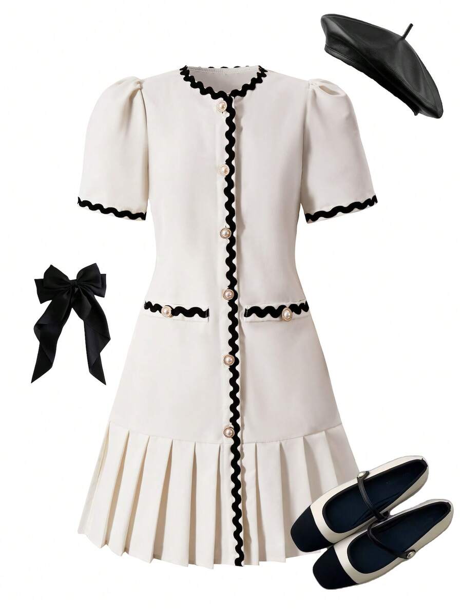 Tween girls apricot short-sleeve pleated smock dress with 3D bow decor and round neckline.