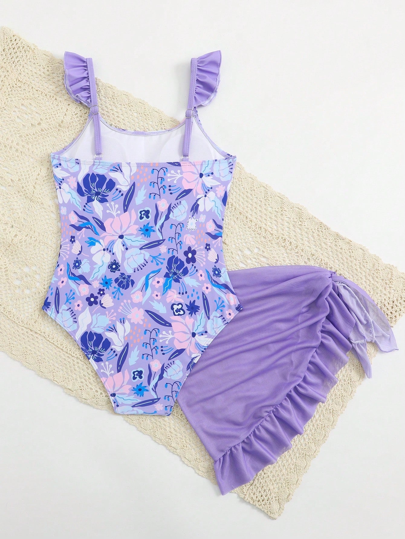 Tween girls one-piece swimsuit in leopard print with ruffle shoulder straps, scoop neckline, fitted shape, and attached ruffle hem skirt; sleeveless, mid-waist skirt bottom, and lined body for swimming, vacation, and summer beach wear.