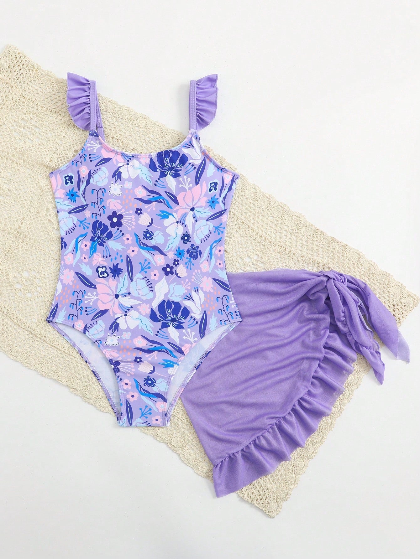 Tween girls one-piece swimsuit in leopard print with ruffle shoulder straps, scoop neckline, fitted shape, and attached ruffle hem skirt; sleeveless, mid-waist skirt bottom, and lined body for swimming, vacation, and summer beach wear.