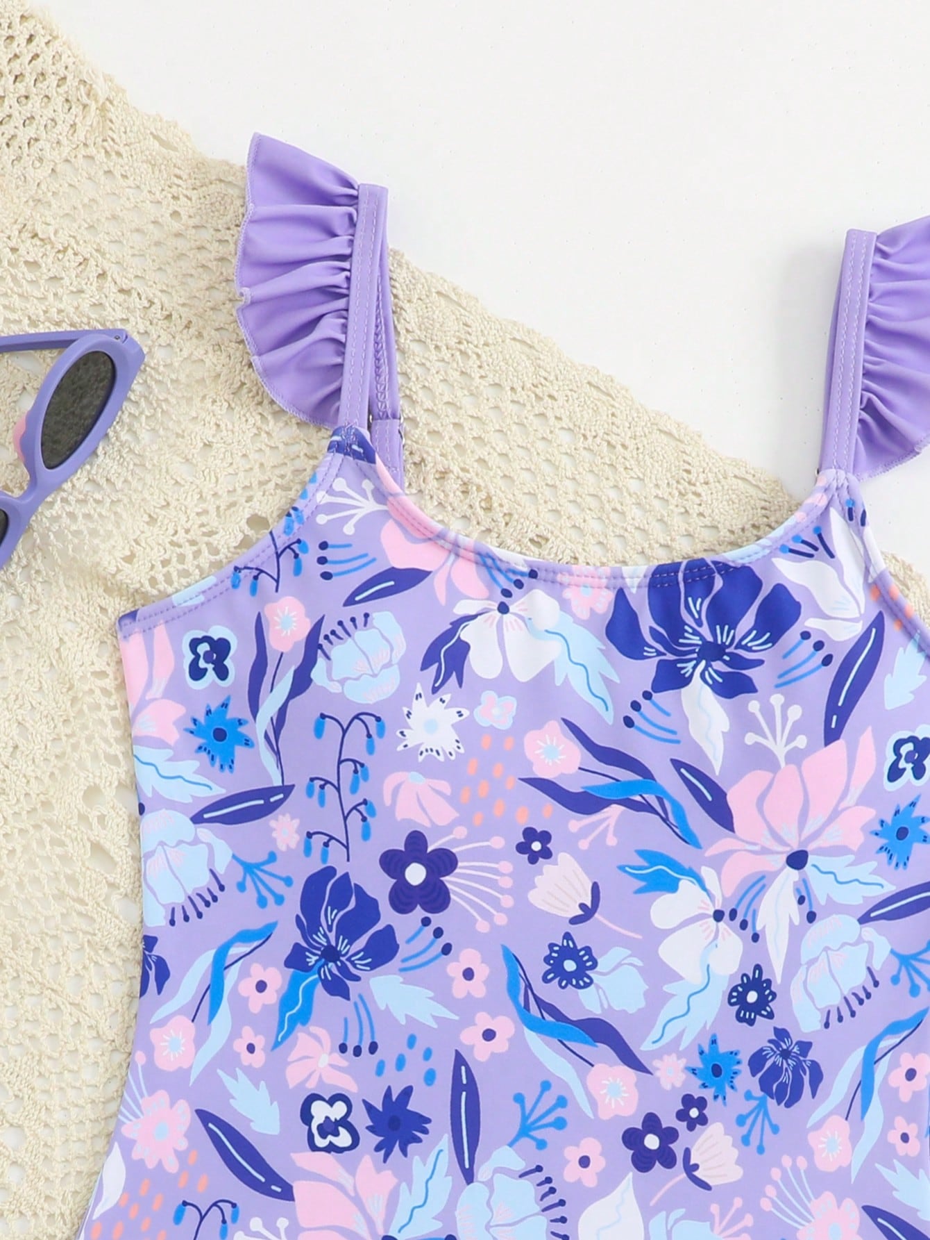 Tween girls one-piece swimsuit in leopard print with ruffle shoulder straps, scoop neckline, fitted shape, and attached ruffle hem skirt; sleeveless, mid-waist skirt bottom, and lined body for swimming, vacation, and summer beach wear.