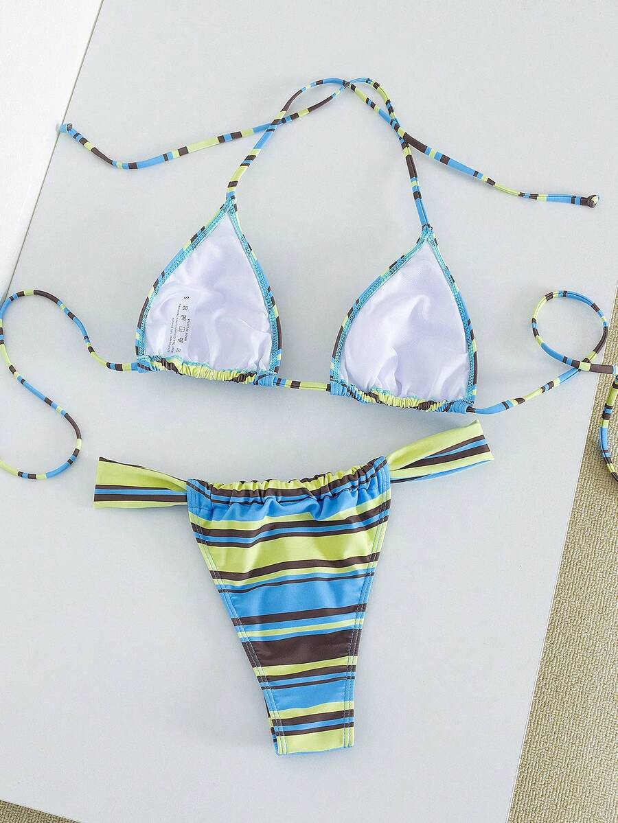 Women's striped halter two-piece swimsuit featuring a lace-up triangle top with removable padding and high-cut low-waist bikini bottoms.