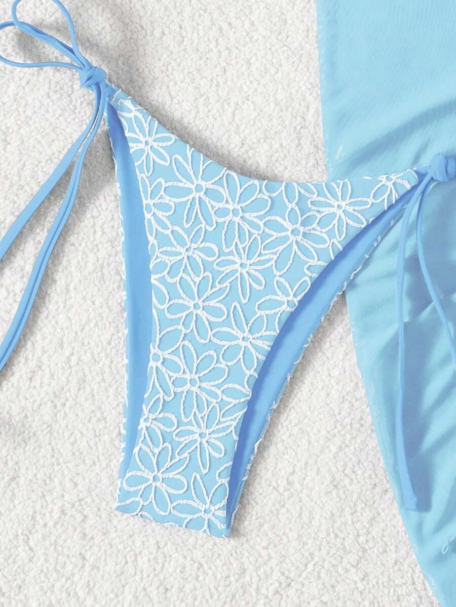 Women's 3-piece blue tropical shell print bikini set featuring a halter bralette top, low-waist tie-side bottom, and a matching sheer mesh cover-up skirt.