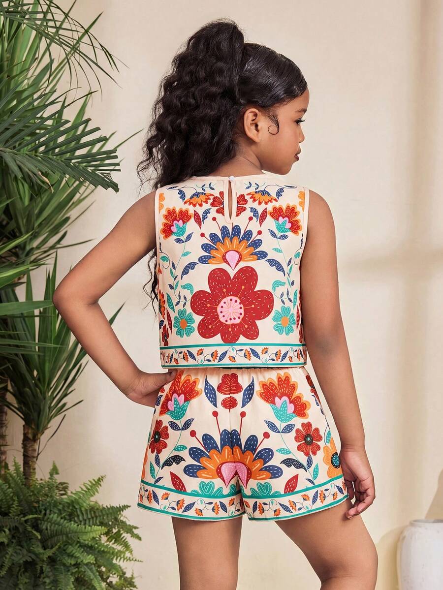 Tween girl wearing a tropical floral print two-piece vacation set featuring a sleeveless round neck tank top with button details and matching shorts.