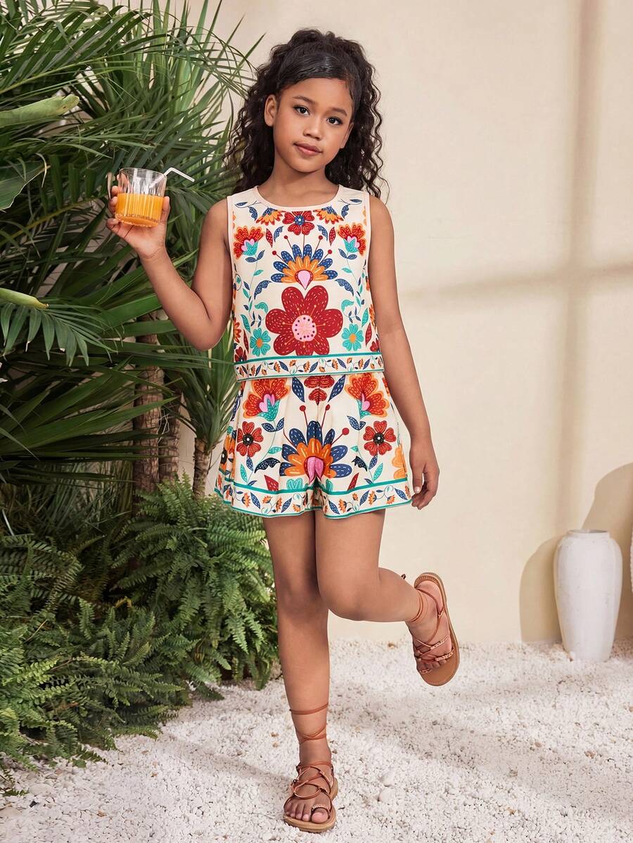 Tween girl wearing a tropical floral print two-piece vacation set featuring a sleeveless round neck tank top with button details and matching shorts.