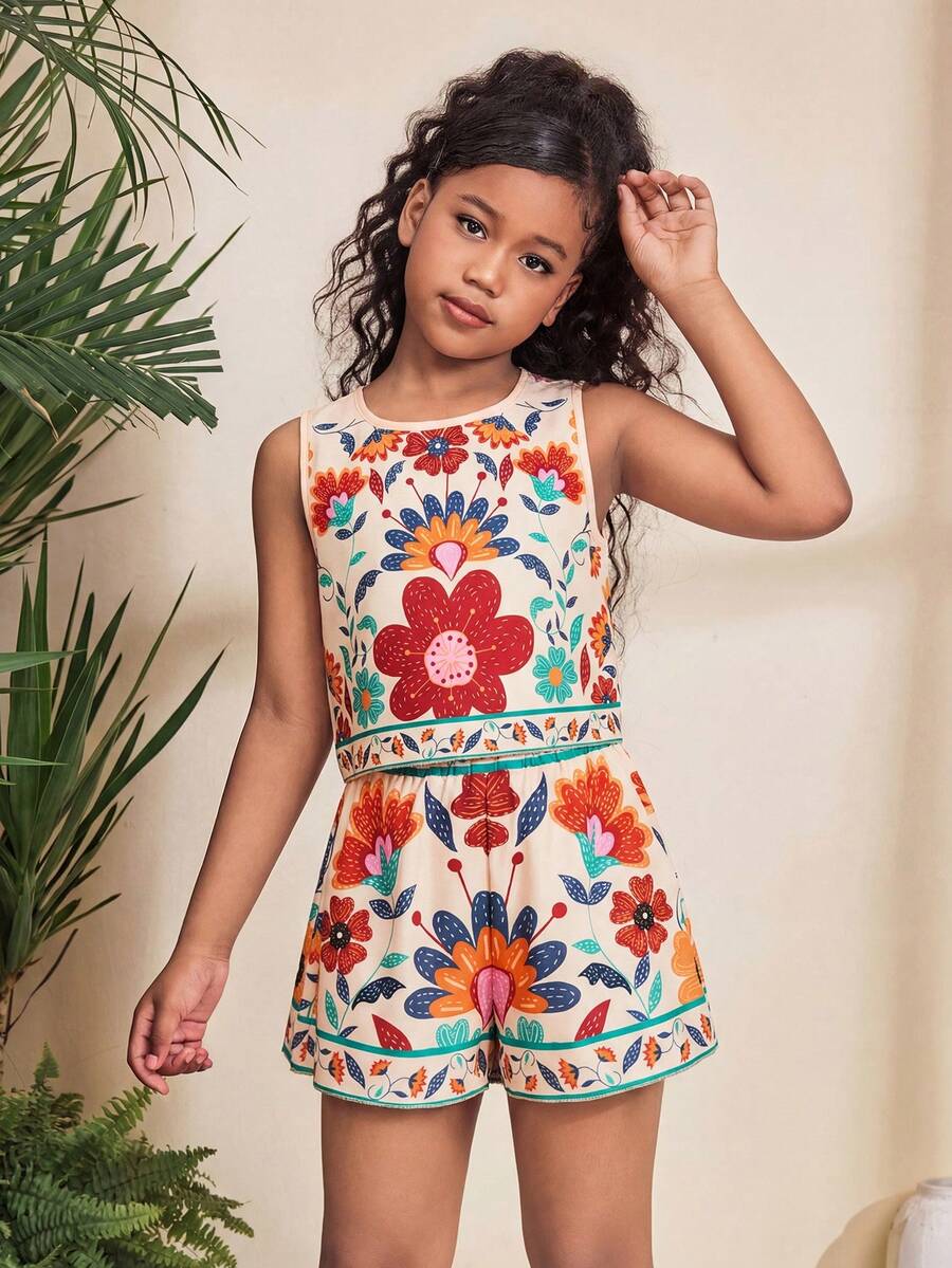 Tween girl wearing a tropical floral print two-piece vacation set featuring a sleeveless round neck tank top with button details and matching shorts.