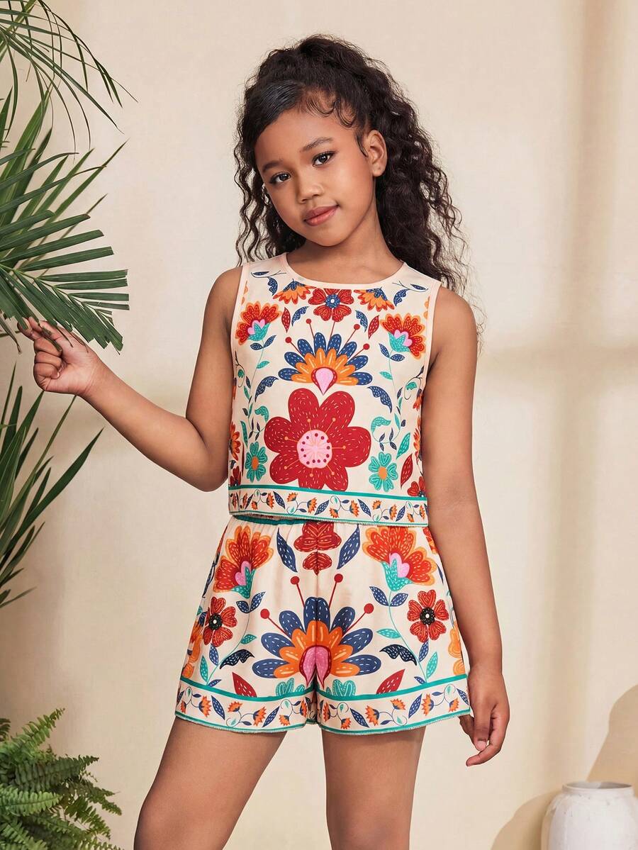 Tween girl wearing a tropical floral print two-piece vacation set featuring a sleeveless round neck tank top with button details and matching shorts.