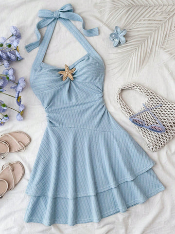 Tween girl summer dress in blue with striped pattern, halter neckline, tie front, sleeveless slim fit, high waist, and tiered ruffle hem for beach vacation and casual holiday wear.