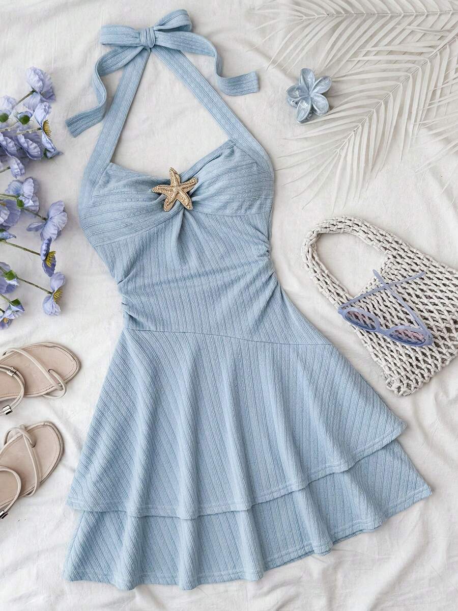 Tween girl summer dress in blue with striped pattern, halter neckline, tie front, sleeveless slim fit, high waist, and tiered ruffle hem for beach vacation and casual holiday wear.