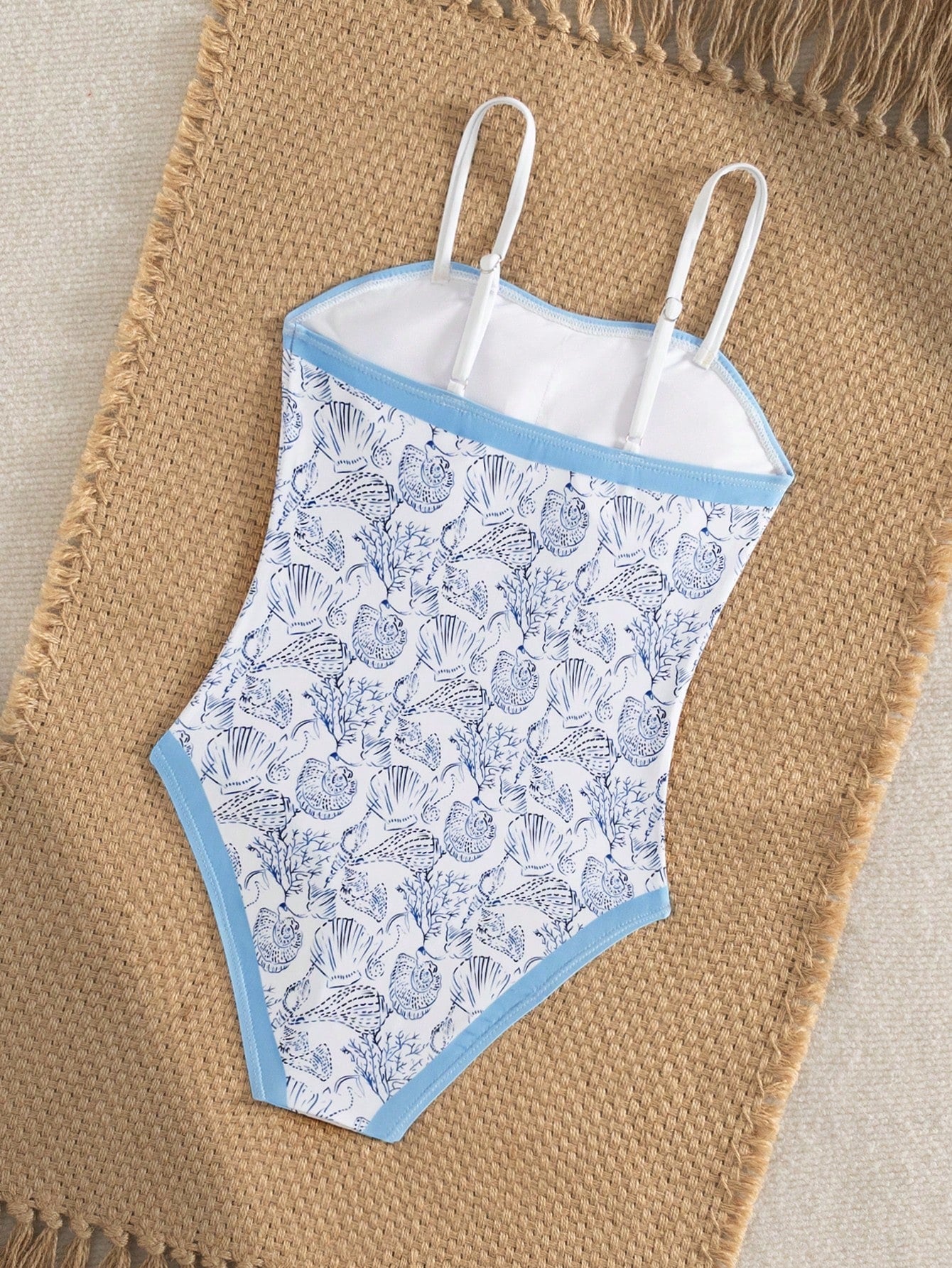 Purple tween girls one-piece swimsuit with asymmetrical neckline, cut-out waist, striped pattern, fitted silhouette, and lined body.