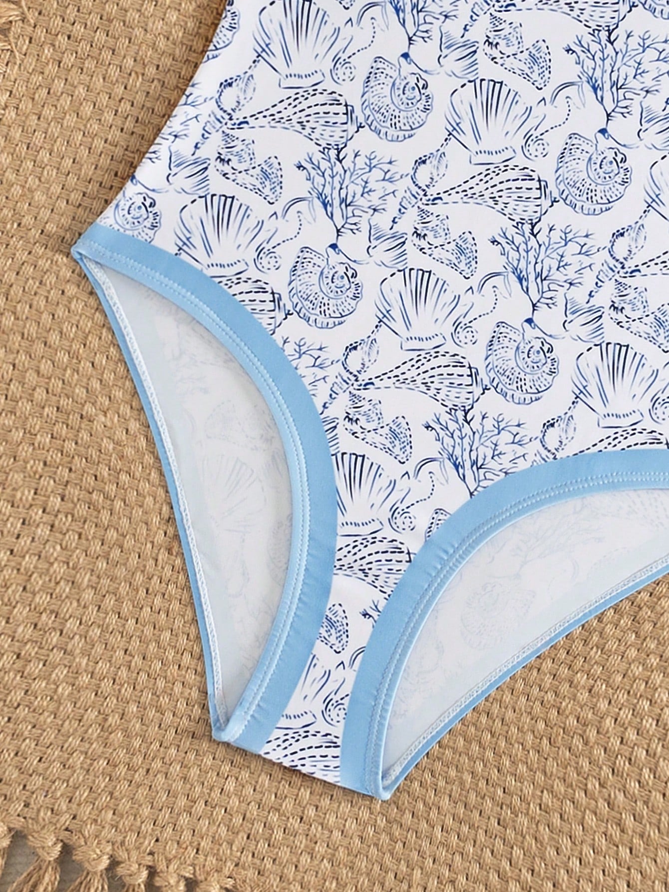 Purple tween girls one-piece swimsuit with asymmetrical neckline, cut-out waist, striped pattern, fitted silhouette, and lined body.