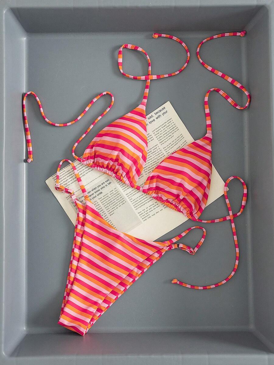 Women's printed halter neck tie two-piece swimwear featuring a wireless triangle top with removable padding and high-waist high-cut bikini bottoms.