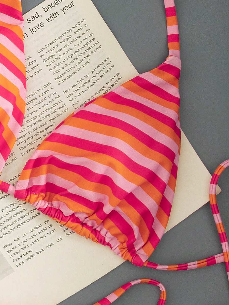 Women's printed halter neck tie two-piece swimwear featuring a wireless triangle top with removable padding and high-waist high-cut bikini bottoms.