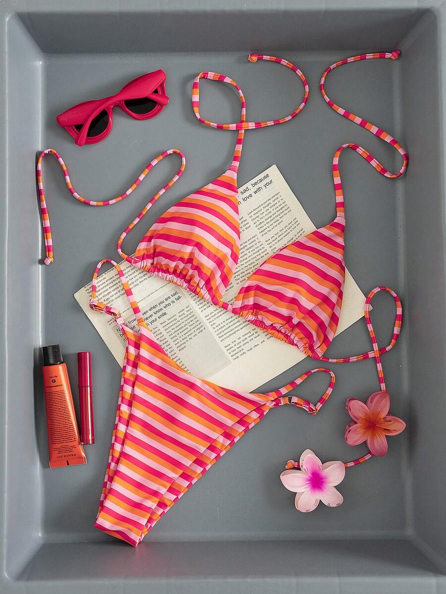 Women's printed halter neck tie two-piece swimwear featuring a wireless triangle top with removable padding and high-waist high-cut bikini bottoms.