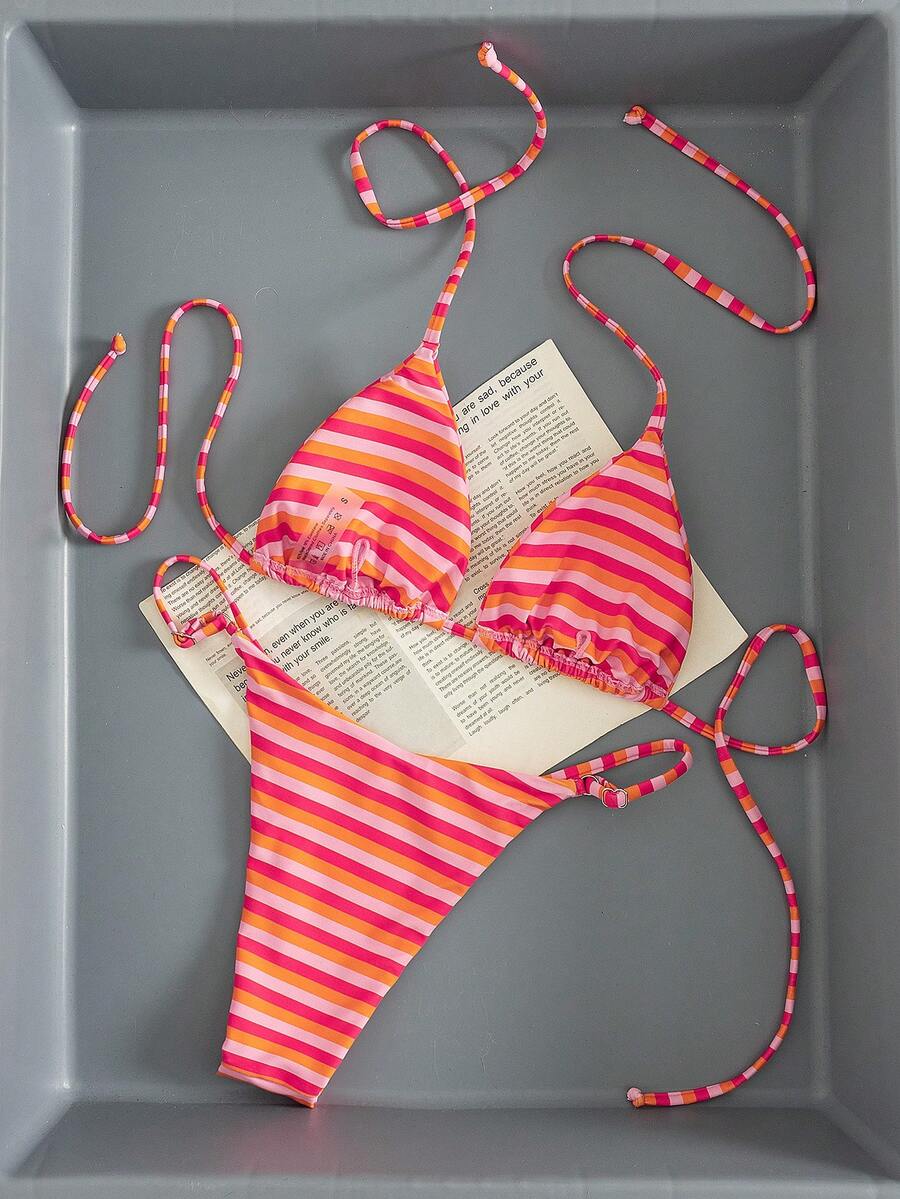 Women's printed halter neck tie two-piece swimwear featuring a wireless triangle top with removable padding and high-waist high-cut bikini bottoms.