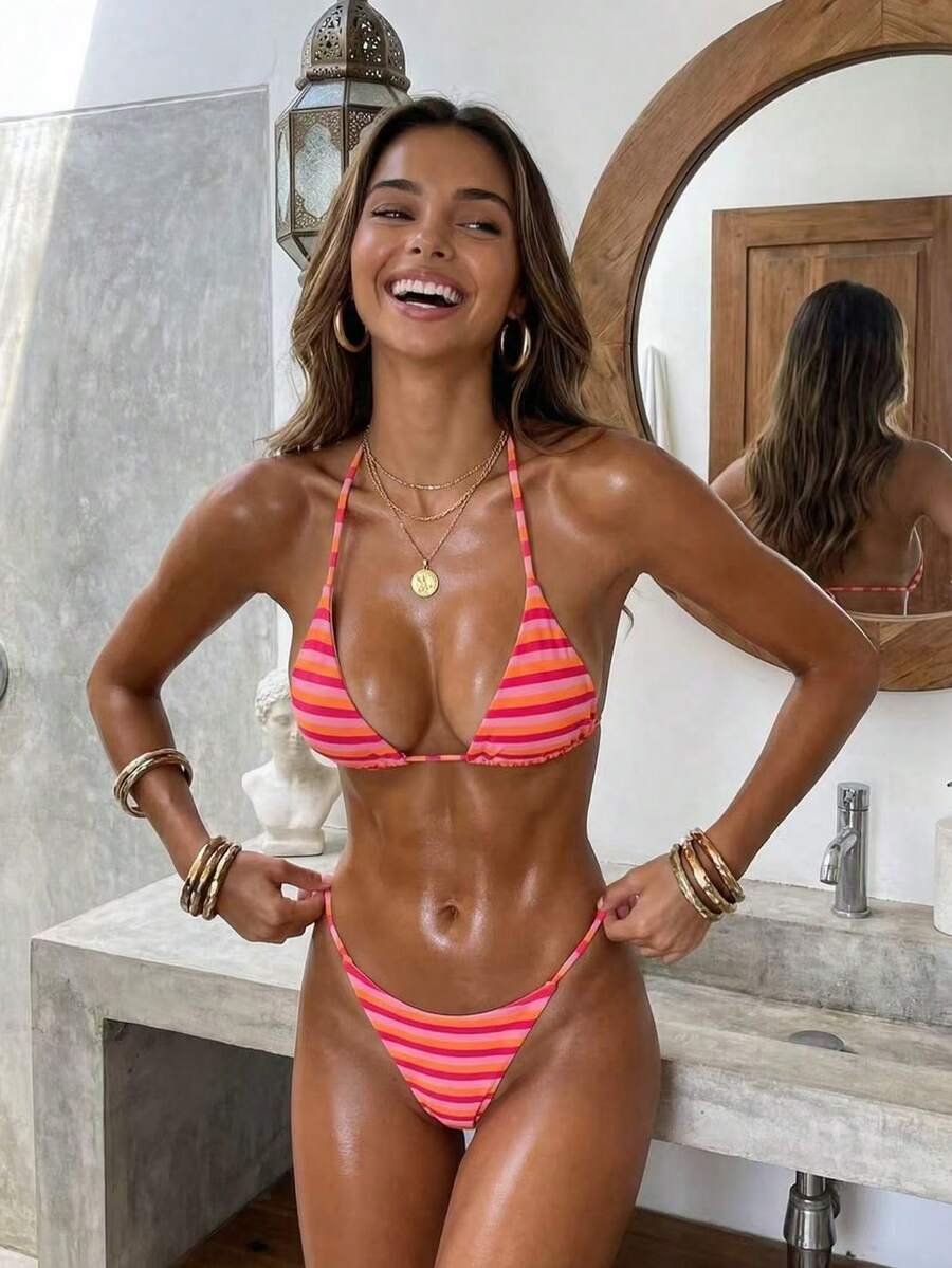 Women's printed halter neck tie two-piece swimwear featuring a wireless triangle top with removable padding and high-waist high-cut bikini bottoms.