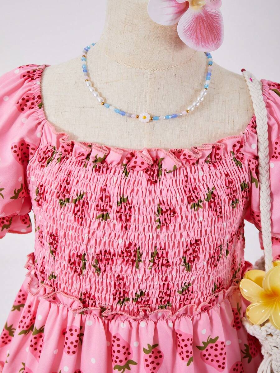 Pink girls strawberry print midi dress with short puff sleeves, square neck, shirred high waist, and tiered layered skirt.
