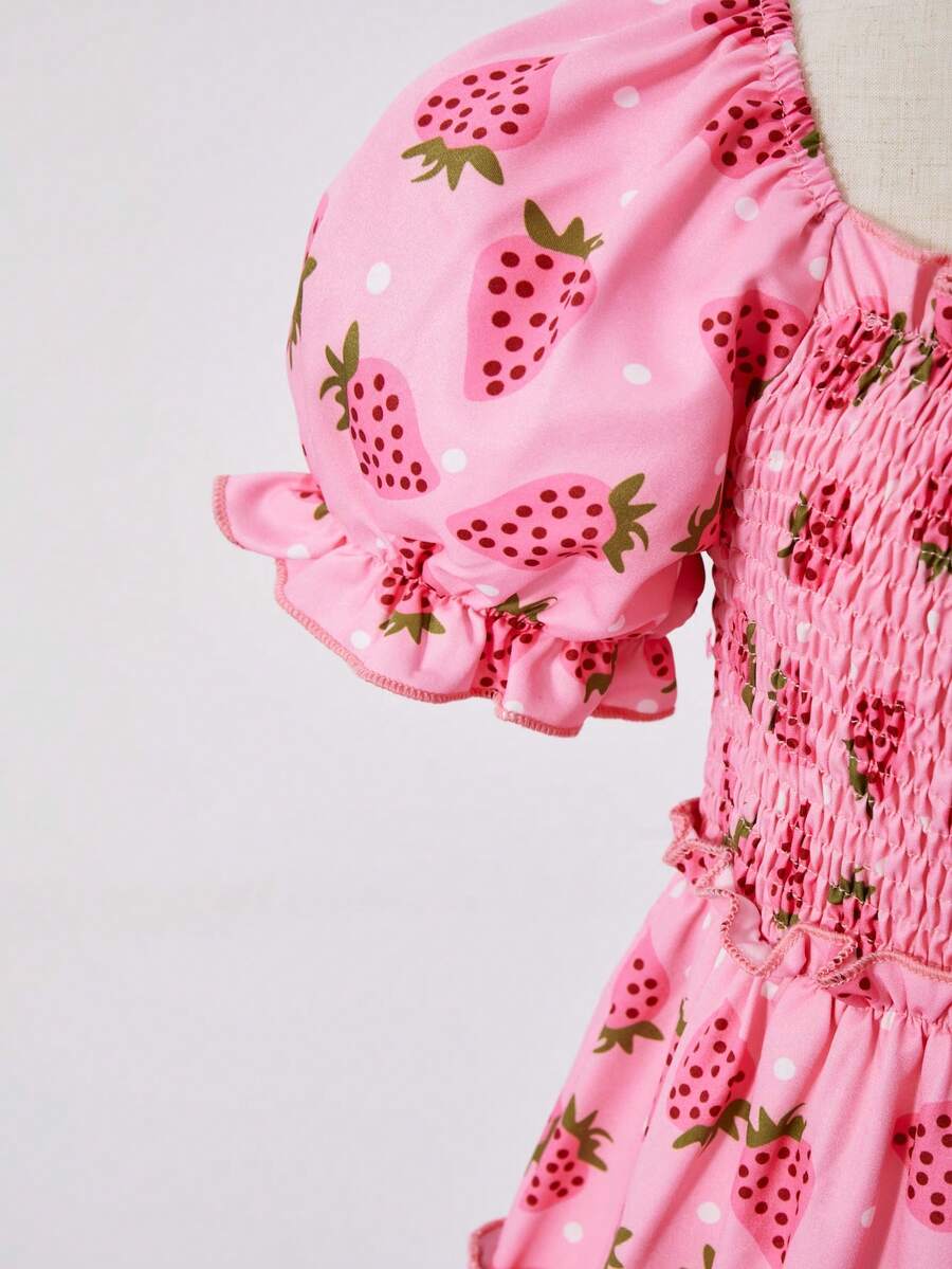 Pink girls strawberry print midi dress with short puff sleeves, square neck, shirred high waist, and tiered layered skirt.