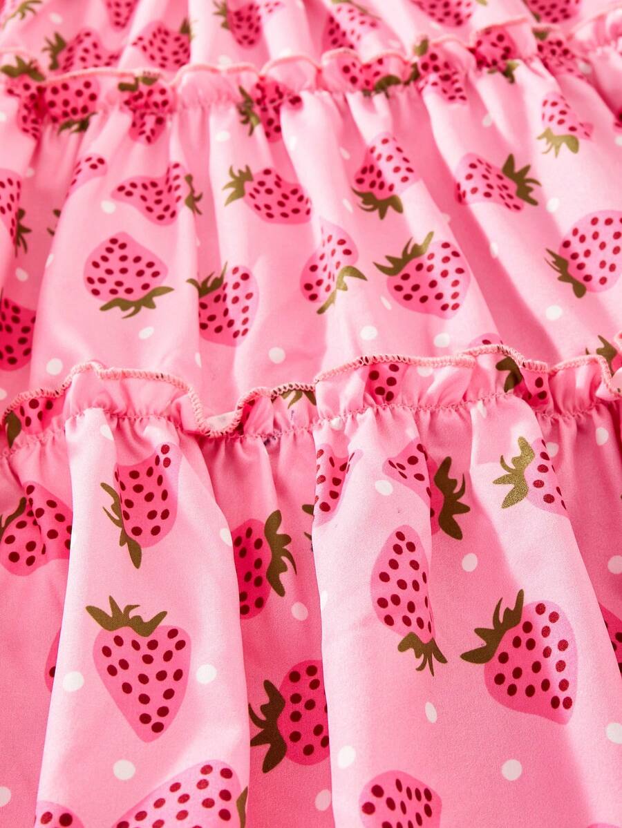 Pink girls strawberry print midi dress with short puff sleeves, square neck, shirred high waist, and tiered layered skirt.