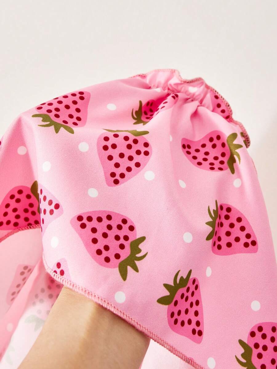 Pink girls strawberry print midi dress with short puff sleeves, square neck, shirred high waist, and tiered layered skirt.