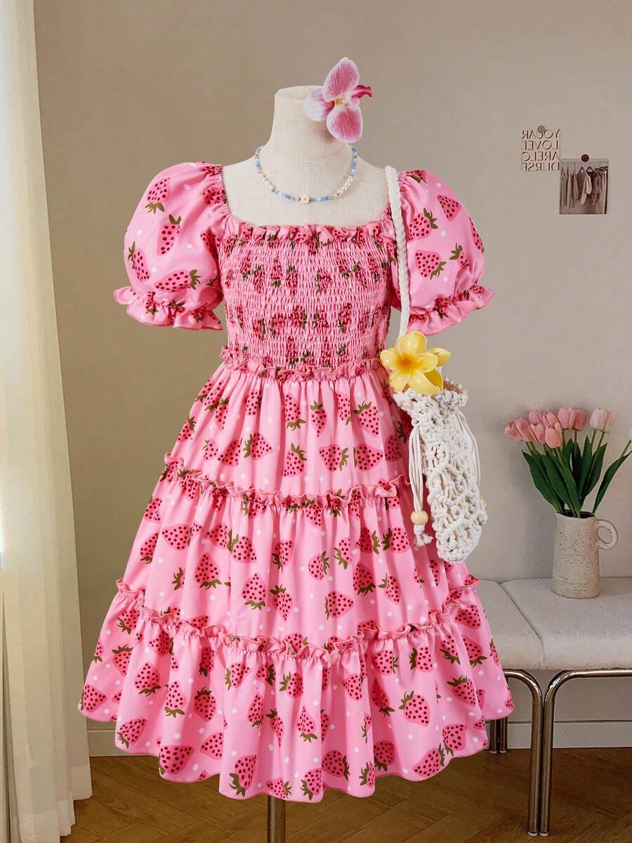 Pink girls strawberry print midi dress with short puff sleeves, square neck, shirred high waist, and tiered layered skirt.