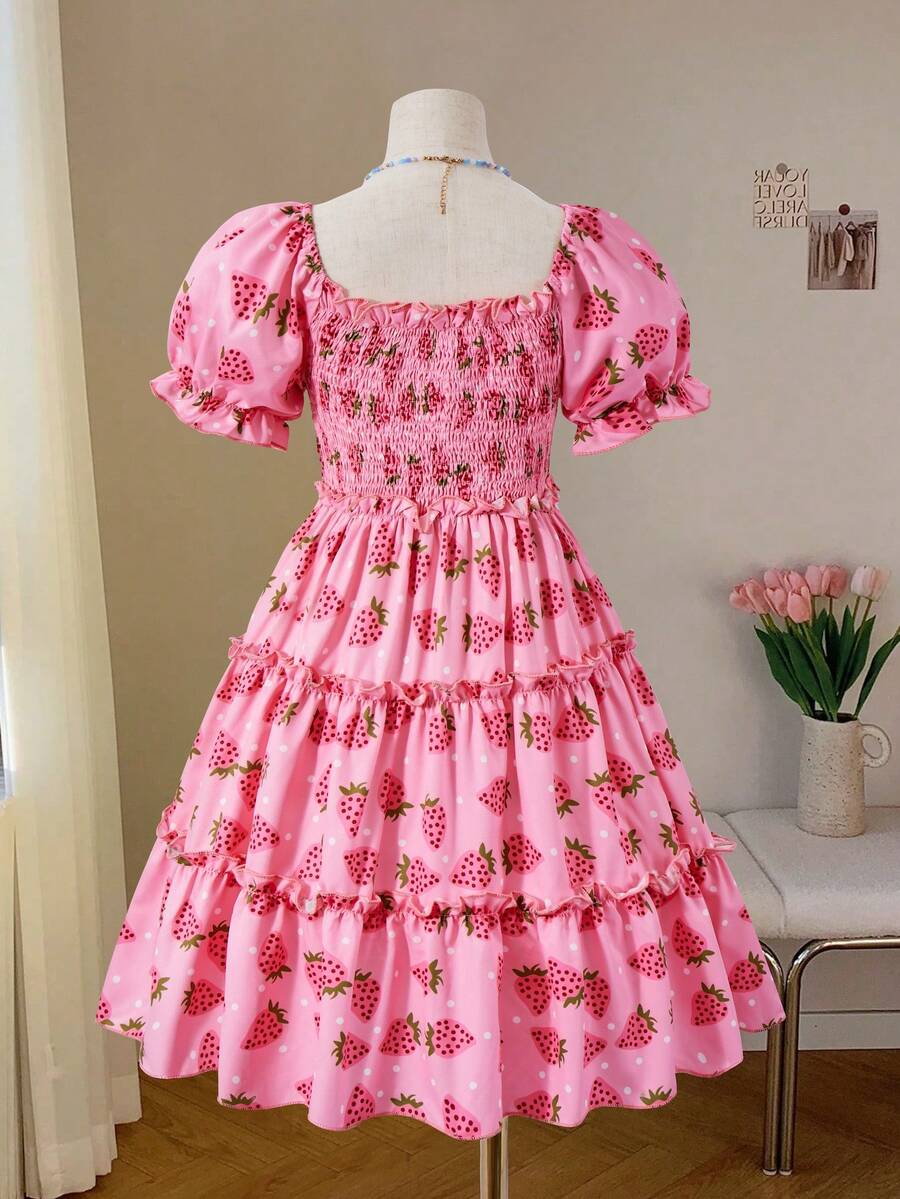 Pink girls strawberry print midi dress with short puff sleeves, square neck, shirred high waist, and tiered layered skirt.