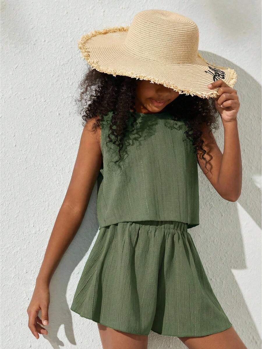 Tween girls army green casual outfit featuring a sleeveless round neck top with button details paired with matching woven loose shorts.