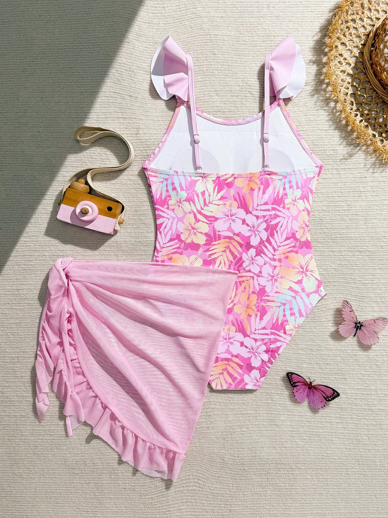 Tween girls one-piece swimsuit in leopard print with ruffle shoulder straps, scoop neckline, fitted shape, and attached ruffle hem skirt; sleeveless, mid-waist skirt bottom, and lined body for swimming, vacation, and summer beach wear.