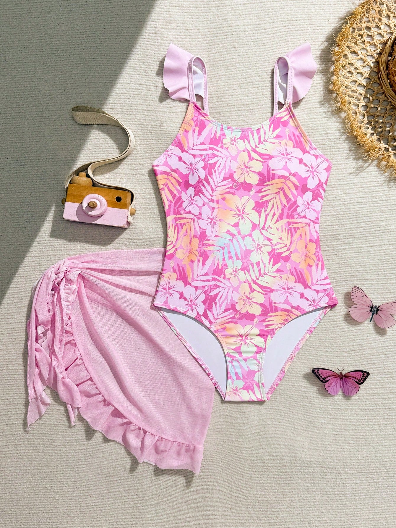 Tween girls one-piece swimsuit in leopard print with ruffle shoulder straps, scoop neckline, fitted shape, and attached ruffle hem skirt; sleeveless, mid-waist skirt bottom, and lined body for swimming, vacation, and summer beach wear.