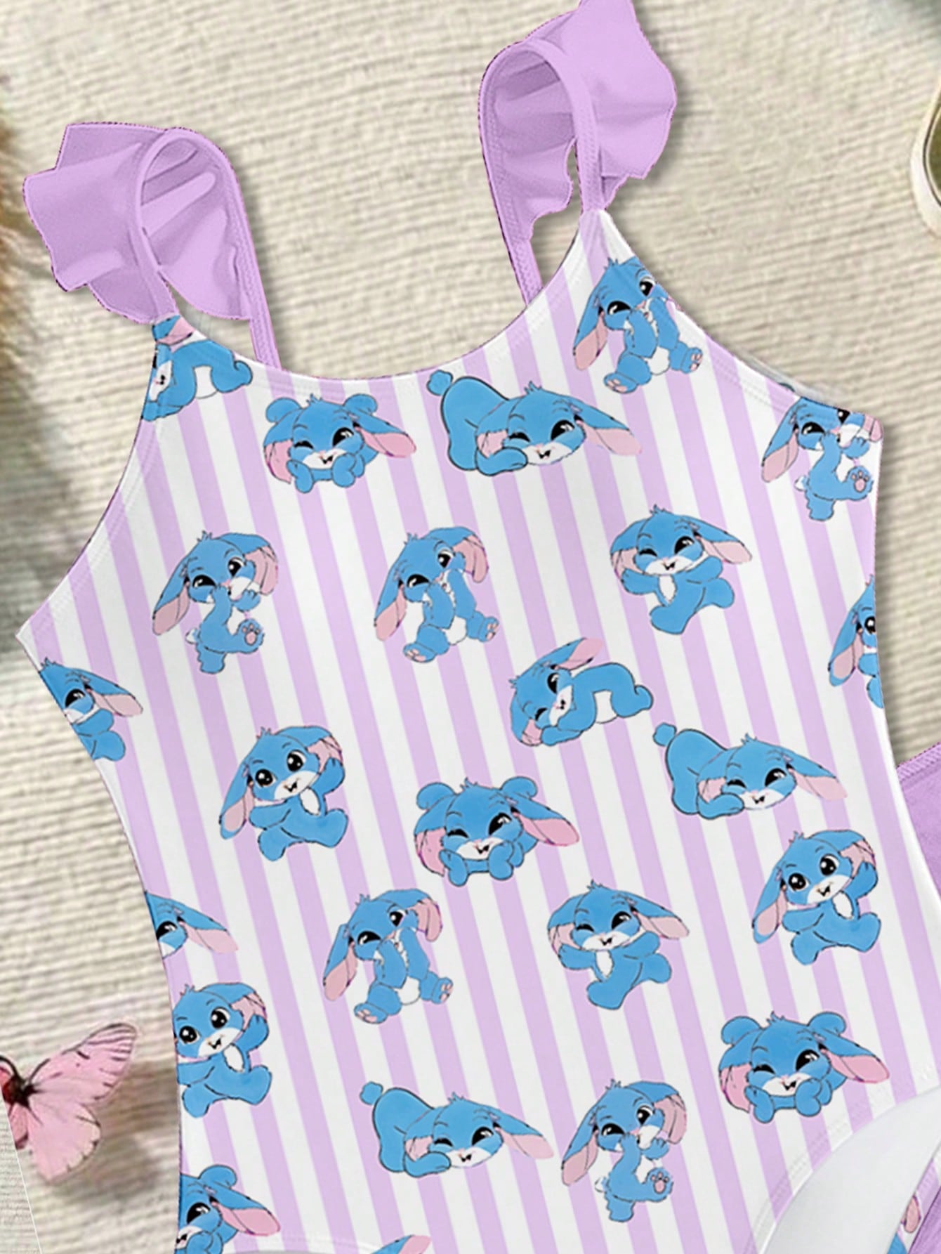 Tween girls one-piece swimsuit in leopard print with ruffle shoulder straps, scoop neckline, fitted shape, and attached ruffle hem skirt; sleeveless, mid-waist skirt bottom, and lined body for swimming, vacation, and summer beach wear.