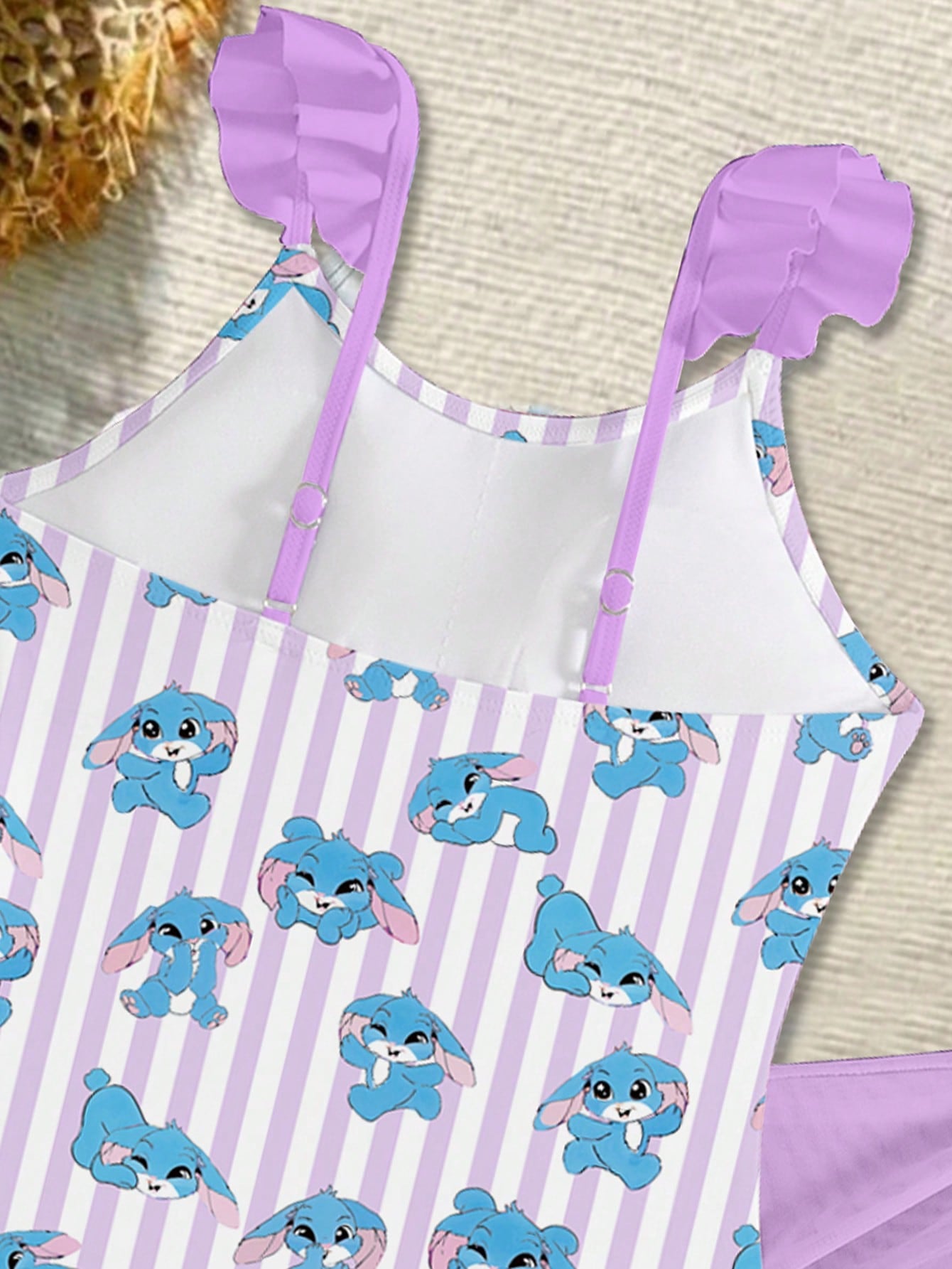 Tween girls one-piece swimsuit in leopard print with ruffle shoulder straps, scoop neckline, fitted shape, and attached ruffle hem skirt; sleeveless, mid-waist skirt bottom, and lined body for swimming, vacation, and summer beach wear.
