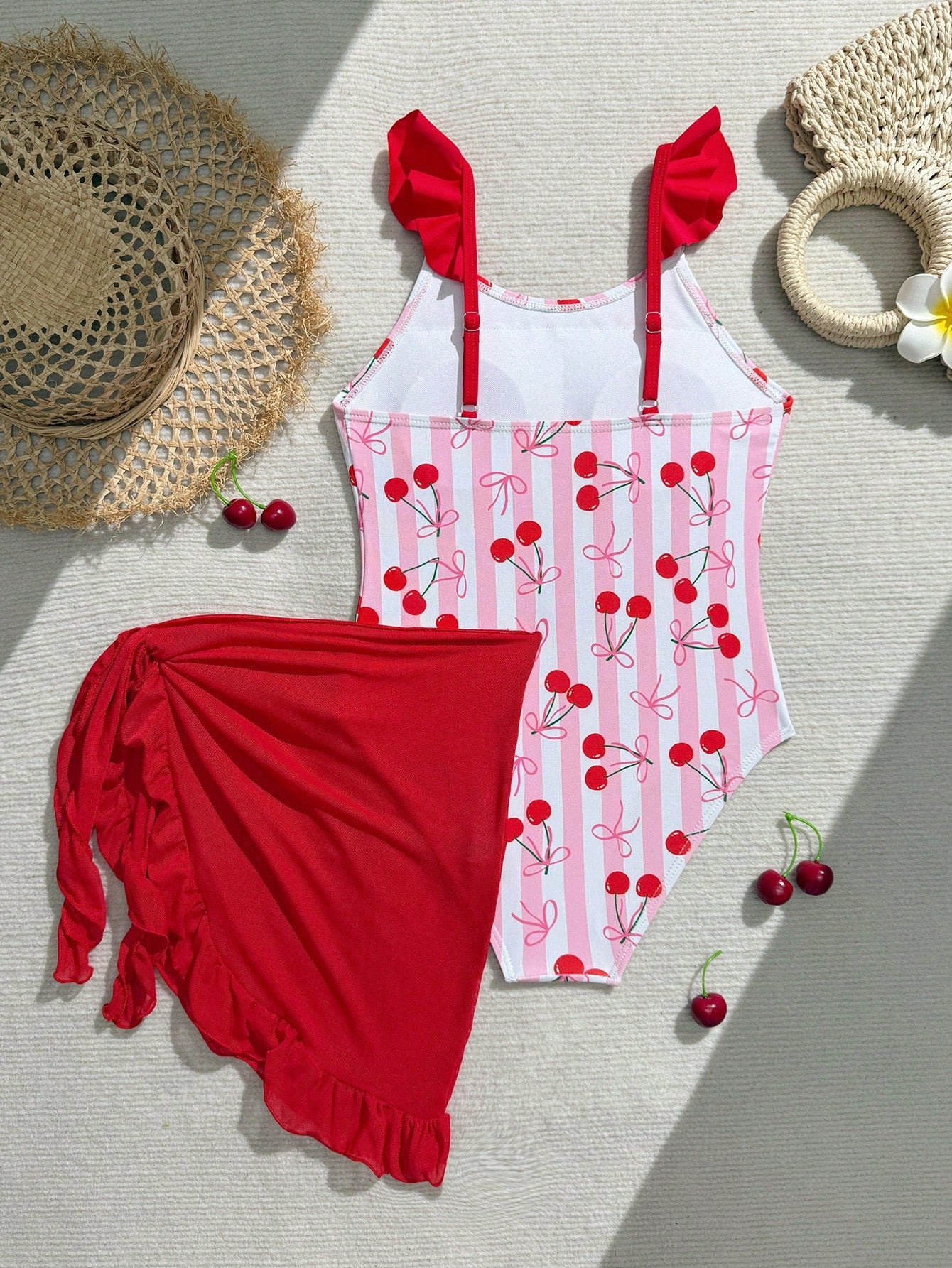 Tween girls one-piece swimsuit in leopard print with ruffle shoulder straps, scoop neckline, fitted shape, and attached ruffle hem skirt; sleeveless, mid-waist skirt bottom, and lined body for swimming, vacation, and summer beach wear.