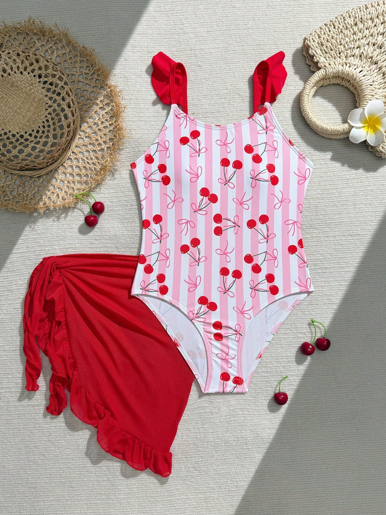 Tween girls one-piece swimsuit in leopard print with ruffle shoulder straps, scoop neckline, fitted shape, and attached ruffle hem skirt; sleeveless, mid-waist skirt bottom, and lined body for swimming, vacation, and summer beach wear.