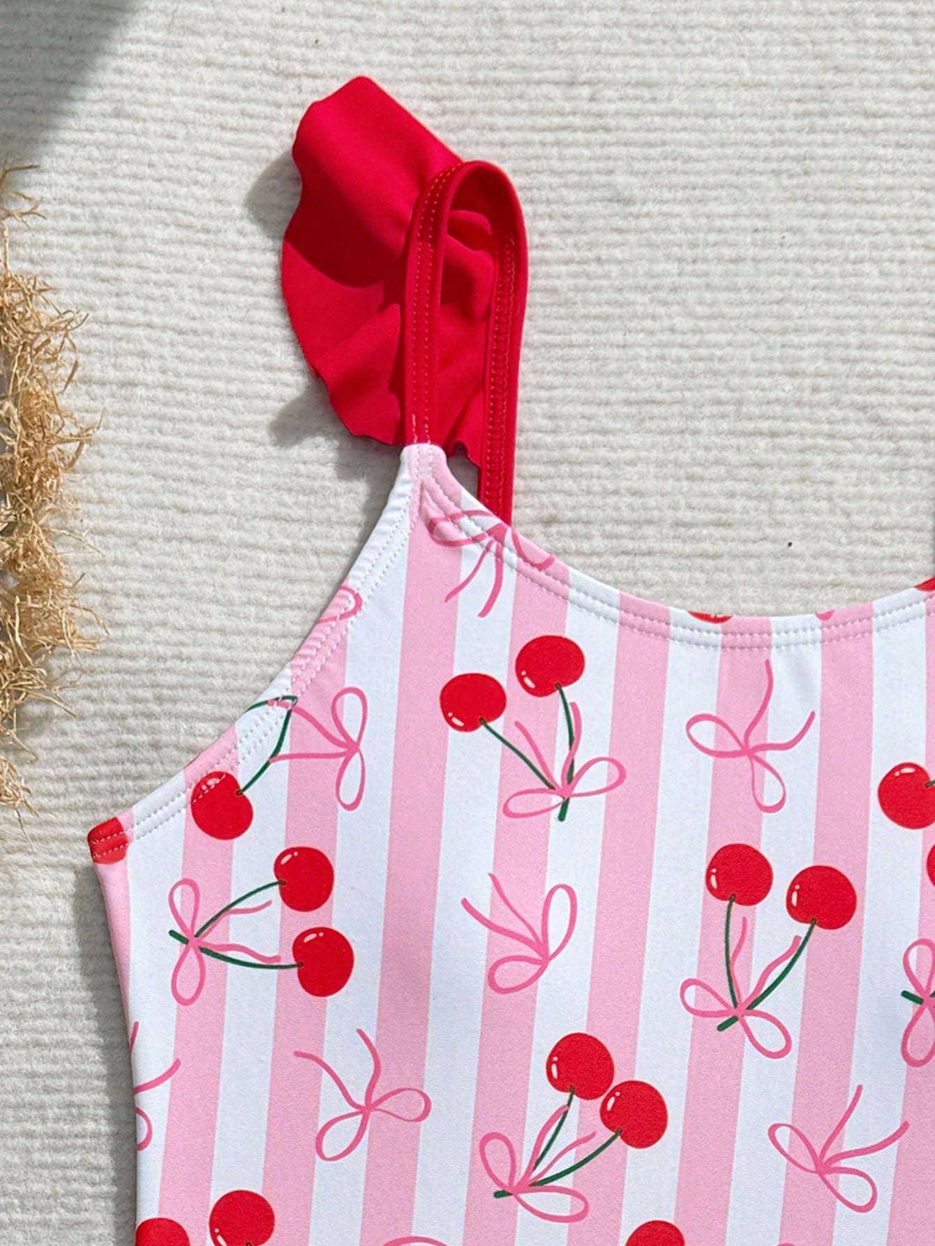 Tween girls one-piece swimsuit in leopard print with ruffle shoulder straps, scoop neckline, fitted shape, and attached ruffle hem skirt; sleeveless, mid-waist skirt bottom, and lined body for swimming, vacation, and summer beach wear.