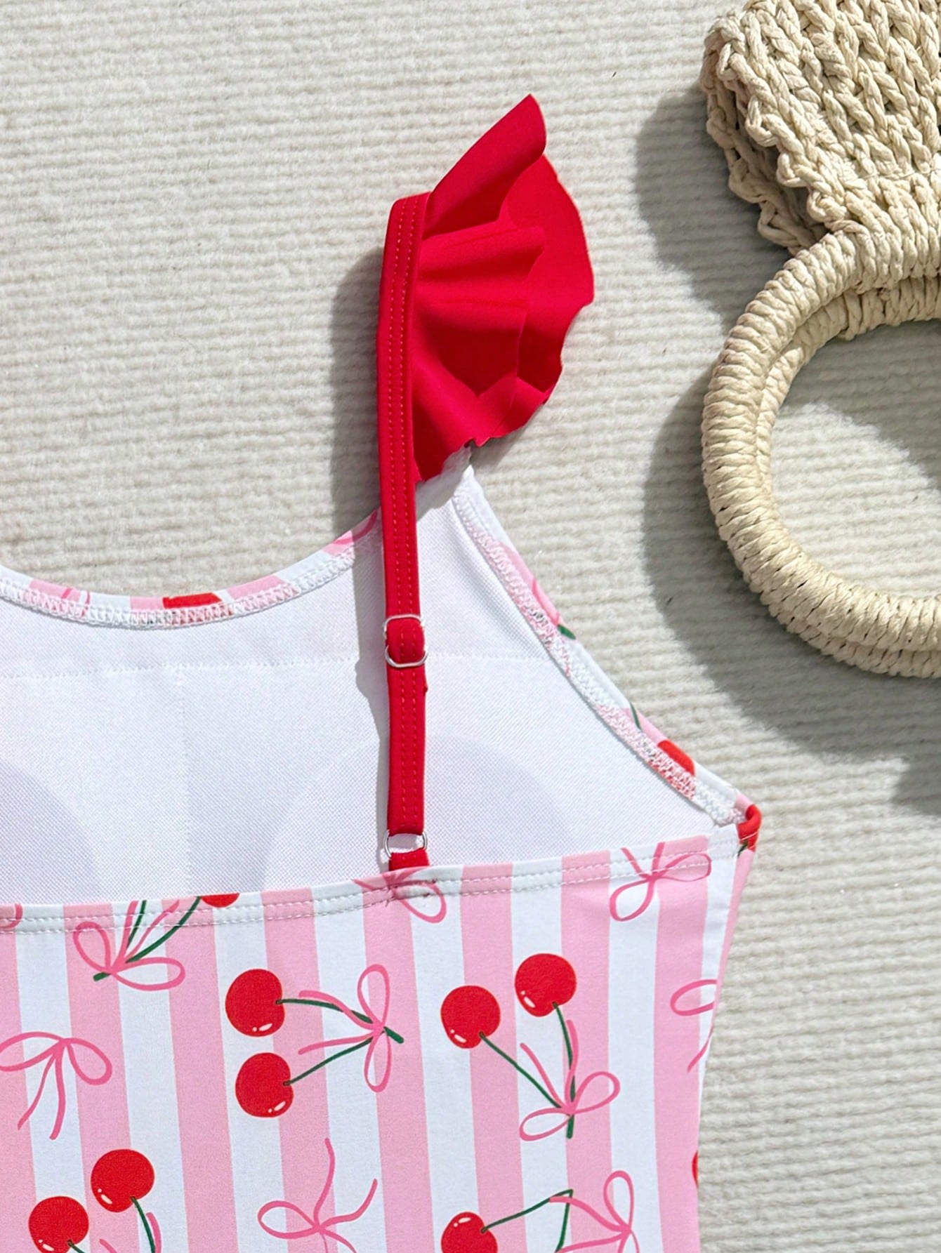 Tween girls one-piece swimsuit in leopard print with ruffle shoulder straps, scoop neckline, fitted shape, and attached ruffle hem skirt; sleeveless, mid-waist skirt bottom, and lined body for swimming, vacation, and summer beach wear.
