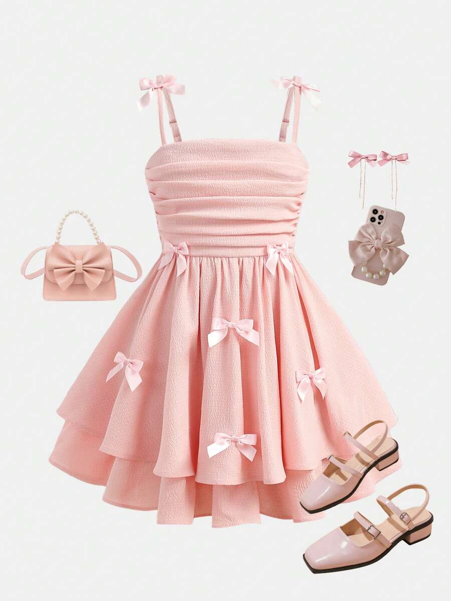 Tween girls apricot tiered cami dress with spaghetti straps, high waist, and slim fit layered hem.