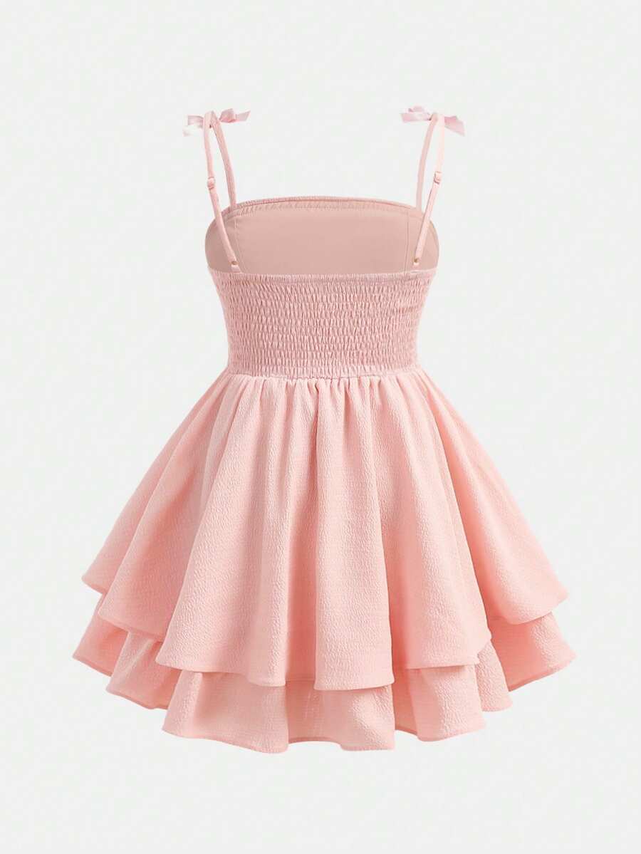 Tween girls apricot tiered cami dress with spaghetti straps, high waist, and slim fit layered hem.