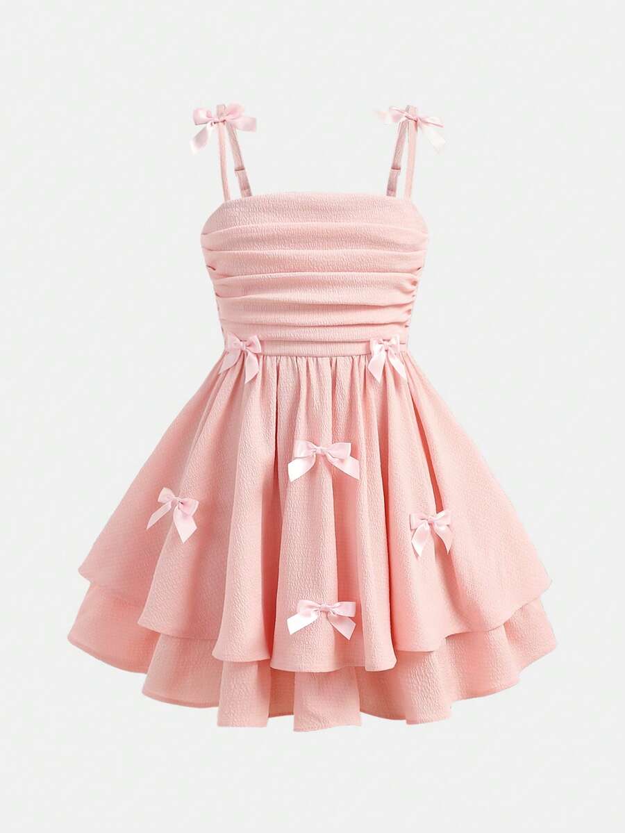 Tween girls apricot tiered cami dress with spaghetti straps, high waist, and slim fit layered hem.