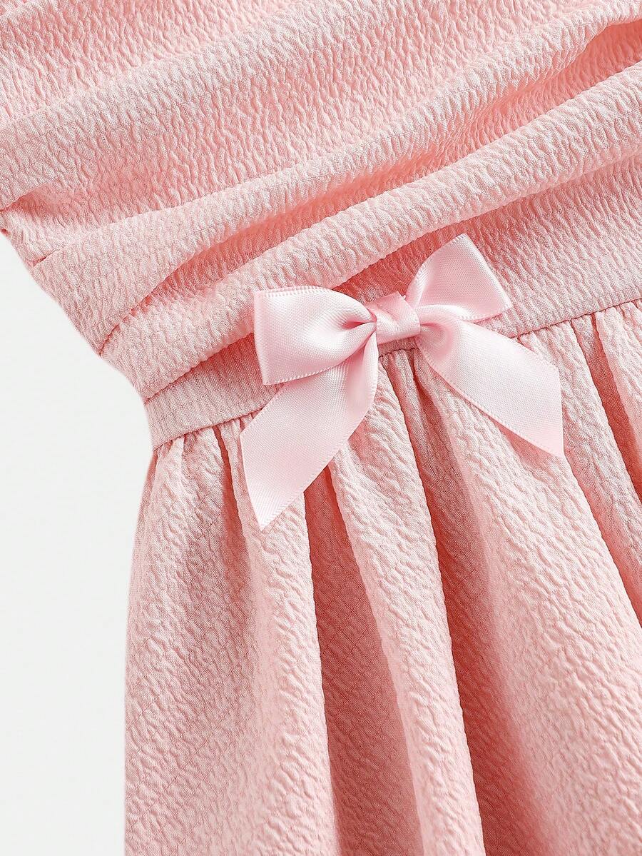 Tween girls apricot tiered cami dress with spaghetti straps, high waist, and slim fit layered hem.