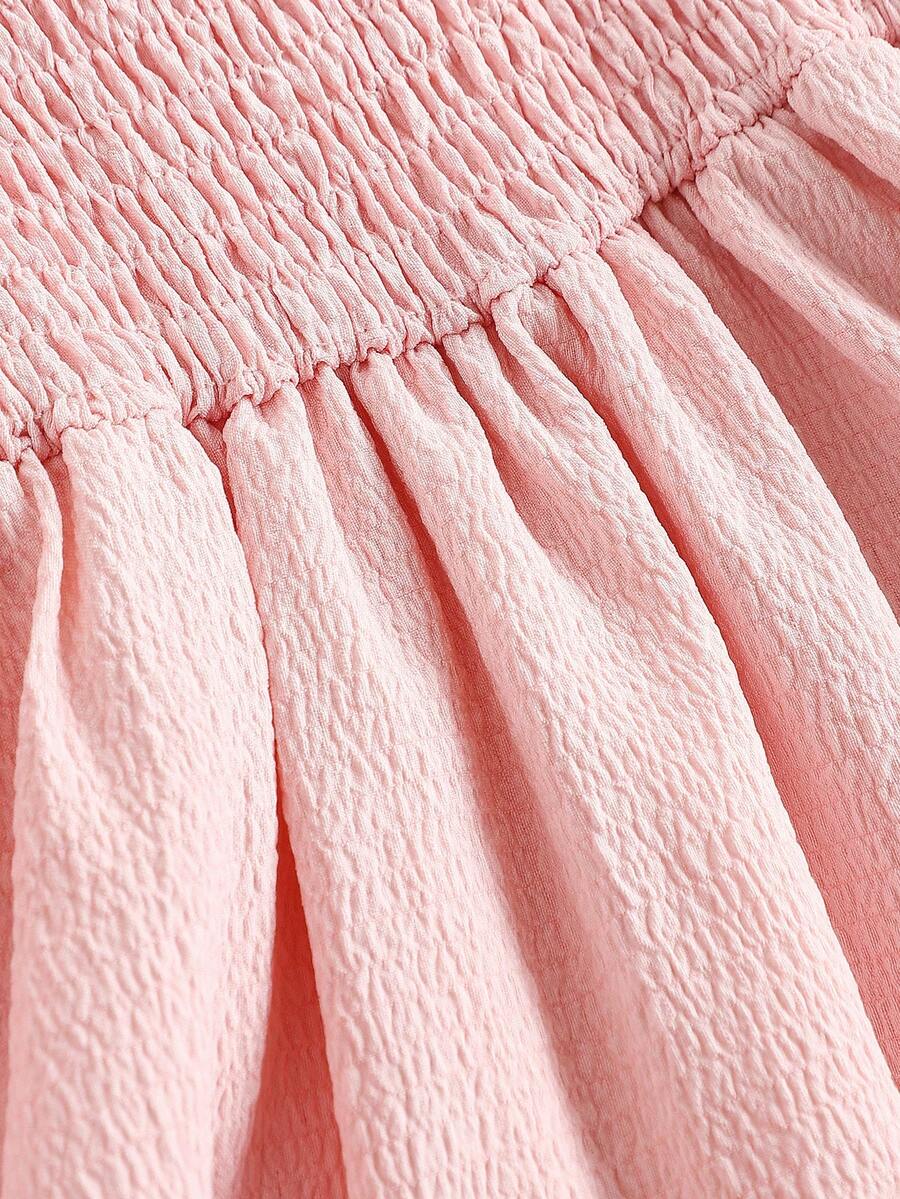 Tween girls apricot tiered cami dress with spaghetti straps, high waist, and slim fit layered hem.