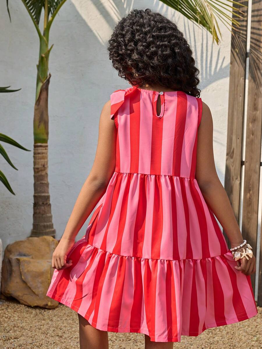 Tween girls blue striped sleeveless smock dress featuring a round neckline, high waist, and flounce ruffle hem.
