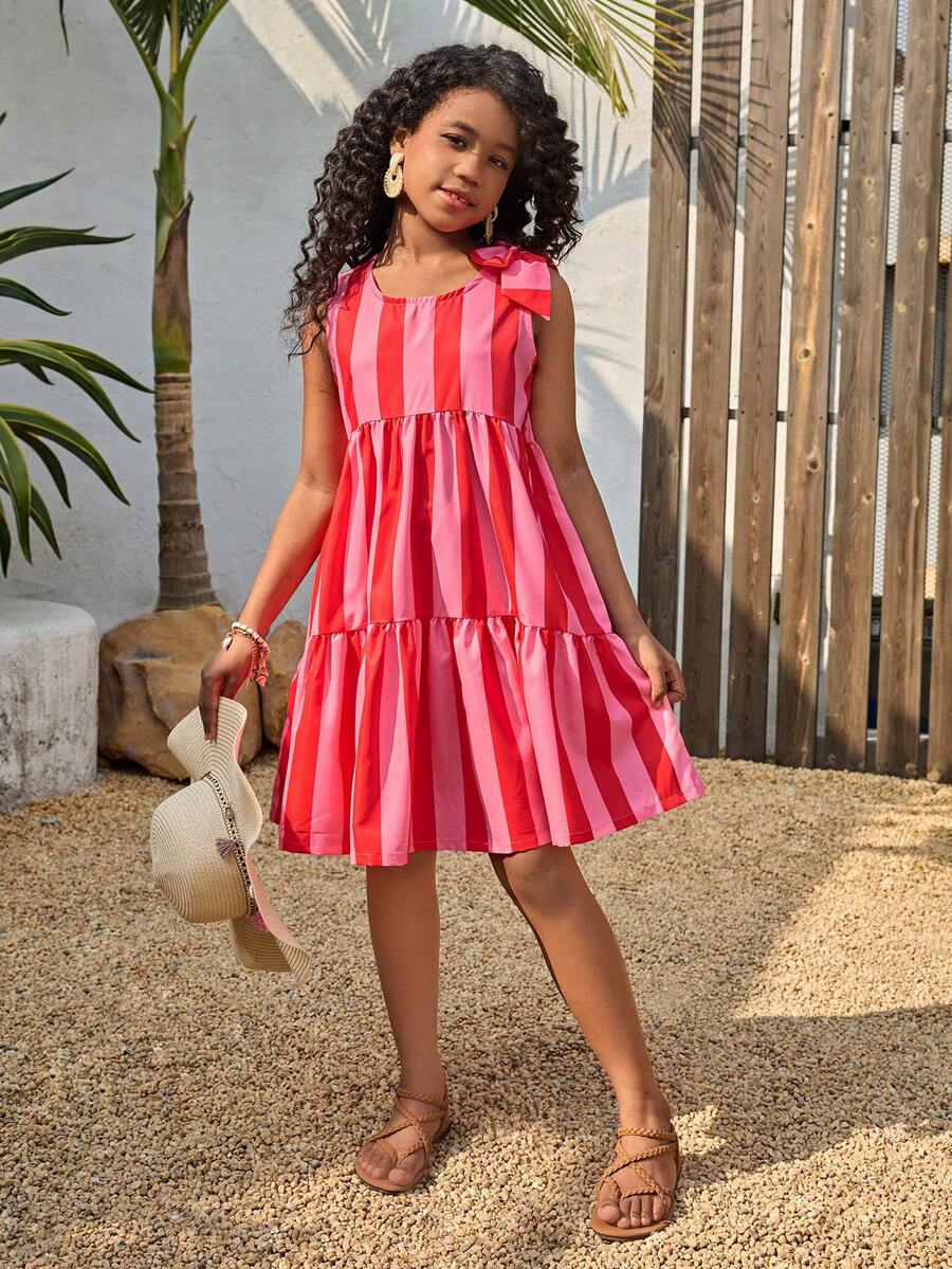 Tween girls blue striped sleeveless smock dress featuring a round neckline, high waist, and flounce ruffle hem.