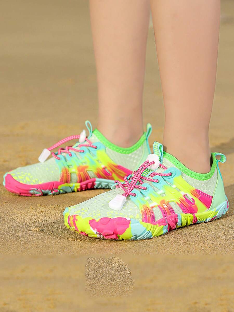 Girls purple quick-drying water shoes featuring a geometric pattern, slip-on fit with lace-up detail, and rubber outsole.