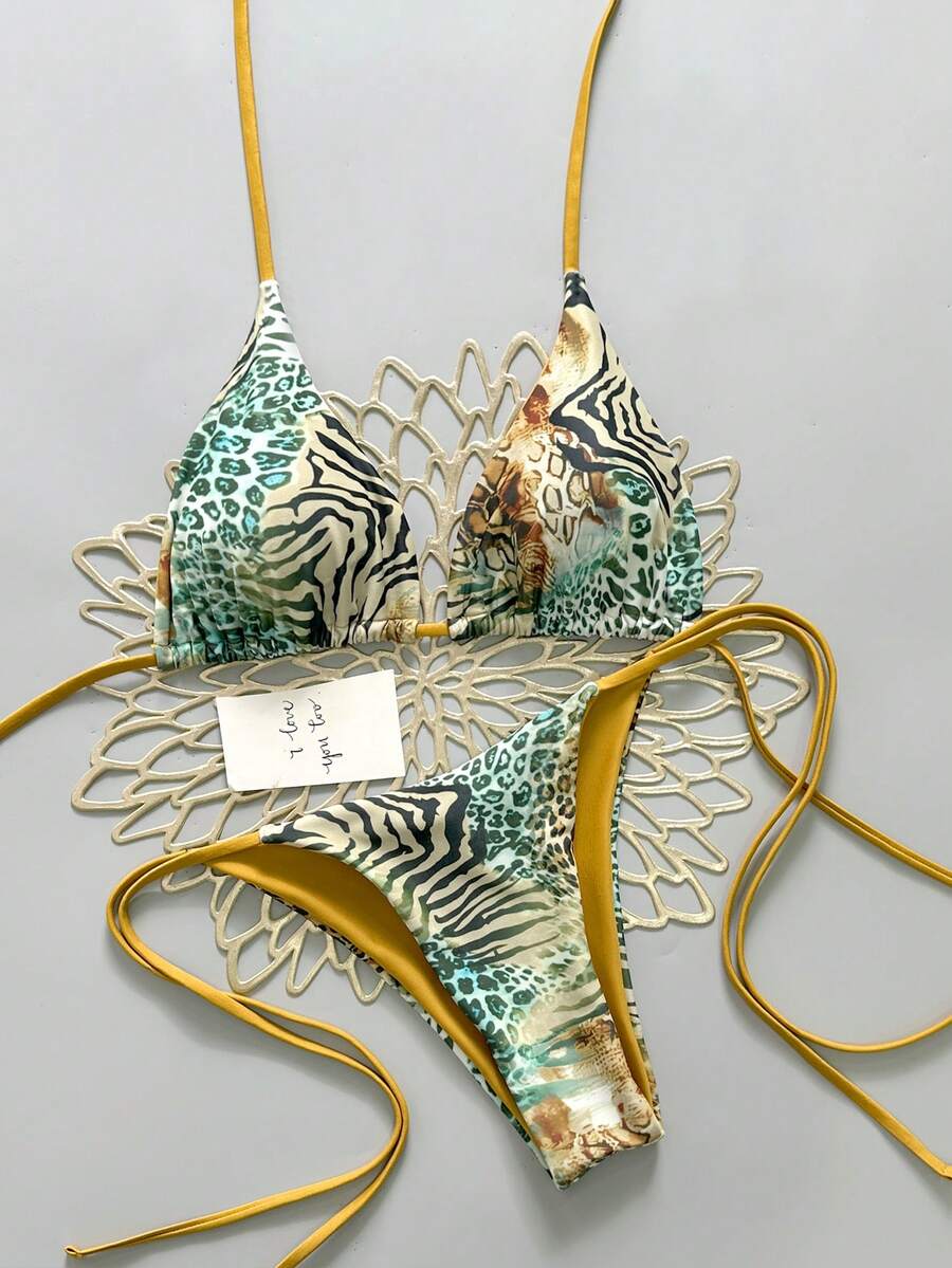 Women's vintage leopard print 2-piece bikini set featuring a high waist tie-side bottom and a halter neck triangle top.