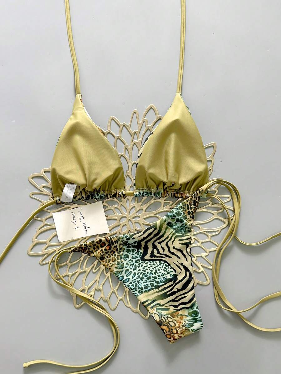 Women's vintage leopard print 2-piece bikini set featuring a high waist tie-side bottom and a halter neck triangle top.
