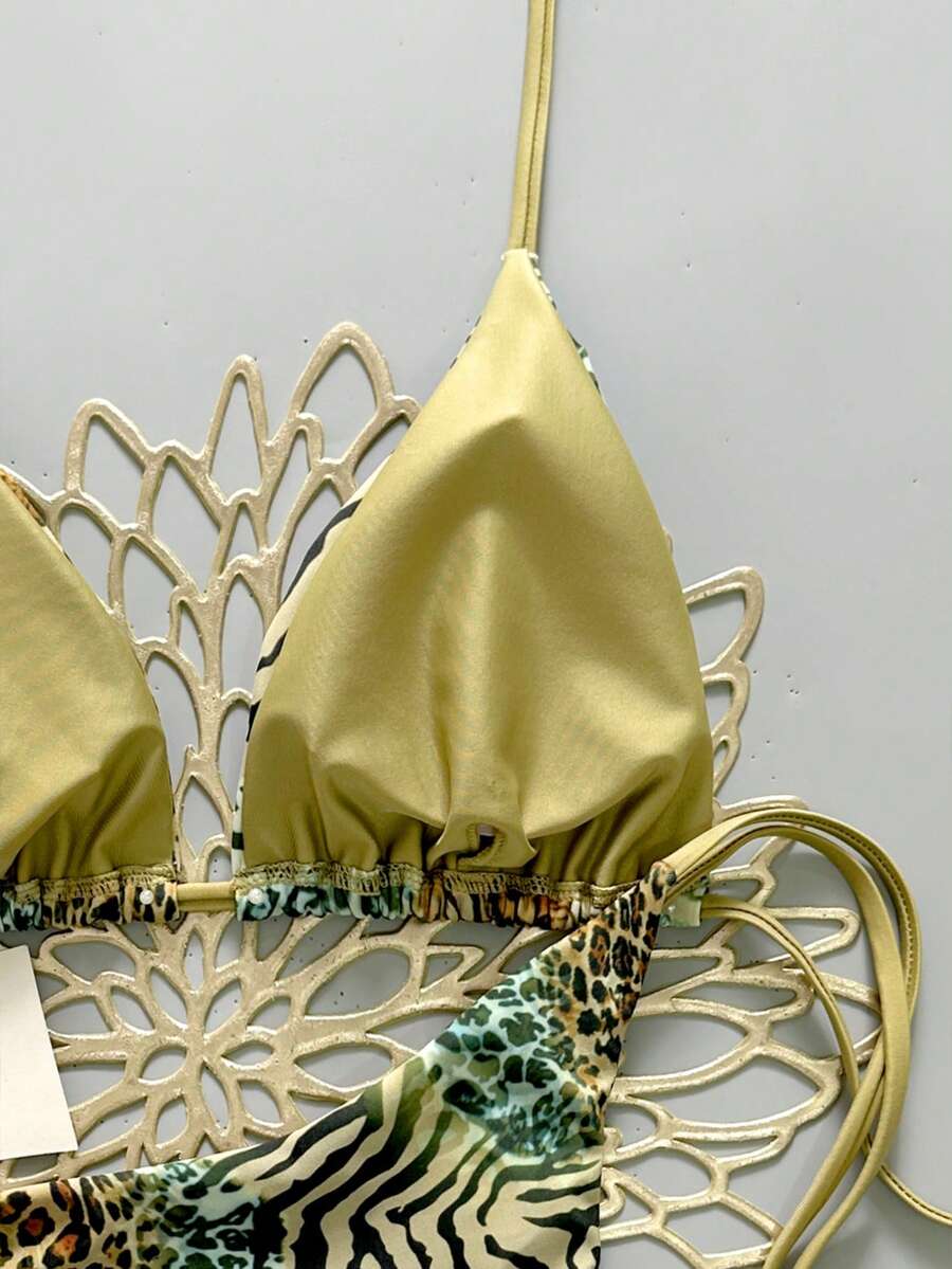 Women's vintage leopard print 2-piece bikini set featuring a high waist tie-side bottom and a halter neck triangle top.