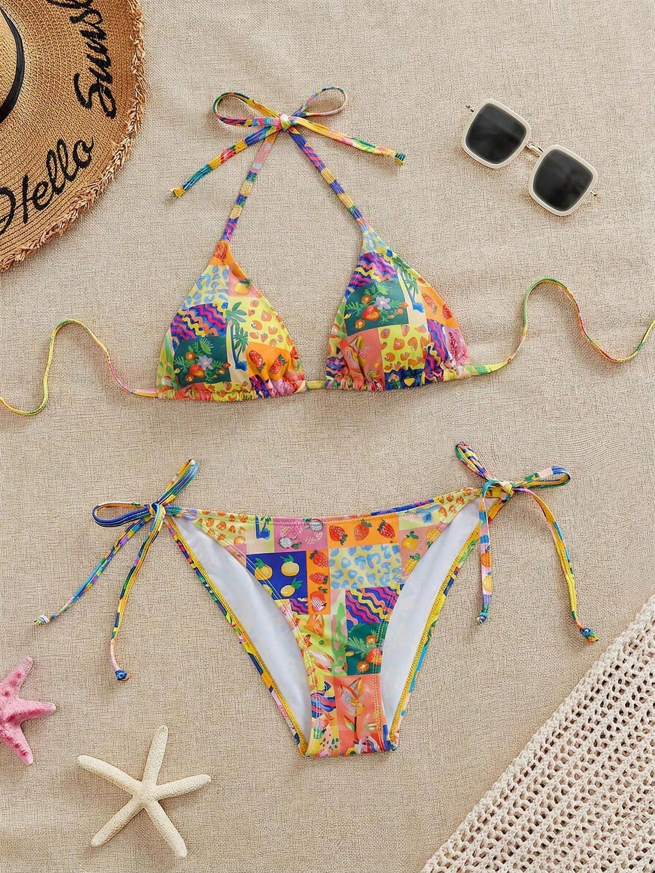 Women's black and white zebra print two-piece bikini set featuring a high waist tie-side bottom and a backless halter top with removable padding.
